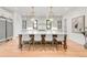 Spacious kitchen island with marble countertop, seating, and pendant lighting at 4452 Xavier St, Denver, CO 80212