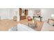 Spacious living room featuring hardwood floors, built-in cabinets, and comfortable seating at 4452 Xavier St, Denver, CO 80212