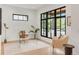 Bright office space with clear desk, large window, wood floors, and neutral decor at 4452 Xavier St, Denver, CO 80212