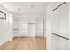 A walk-in closet providing ample storage with custom shelving and hanging racks at 4452 Xavier St, Denver, CO 80212