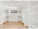 Walk-in closet with lots of storage space and a window for natural light at 4452 Xavier St, Denver, CO 80212