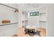 Walk-in closet with custom shelving, seating, and a dark-colored rug for style at 4452 Xavier St, Denver, CO 80212