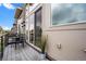 Private balcony featuring a seating area and view of the building's exterior at 3480 E 31St Ave, Denver, CO 80205