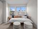 Bright bedroom with daybed, stools, and large windows at 3480 E 31St Ave, Denver, CO 80205