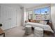 Well-lit bedroom featuring a cozy daybed and ample natural light at 3480 E 31St Ave, Denver, CO 80205