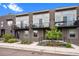 Modern townhomes with black iron railings and gray exterior paint, plus a small balcony at 3480 E 31St Ave, Denver, CO 80205
