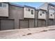 Contemporary building featuring private garages for each unit in the community at 3480 E 31St Ave, Denver, CO 80205