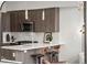 Chic kitchen with stainless steel appliances, quartz countertops, and stylish pendant lighting at 3480 E 31St Ave, Denver, CO 80205
