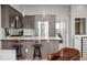 Stylish kitchen with wood cabinets, quartz countertops, and stainless steel appliances at 3480 E 31St Ave, Denver, CO 80205