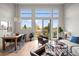 Open-concept living room with floor-to-ceiling windows and comfortable seating at 3480 E 31St Ave, Denver, CO 80205