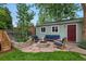 Private backyard features a stone patio, fire pit, and built-in seating at 3424 W 31St Ave, Denver, CO 80211