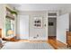 Bedroom showcasing hardwood floors, large windows, closet space and neutral wall colors at 3424 W 31St Ave, Denver, CO 80211