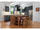 Modern kitchen island with wooden stools, offering both style and functionality at 3424 W 31St Ave, Denver, CO 80211