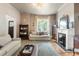 Bright living room featuring a fireplace, hardwood floors and natural light at 3424 W 31St Ave, Denver, CO 80211