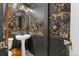 Stylish powder room with dramatic wallpaper and pedestal sink at 3424 W 31St Ave, Denver, CO 80211