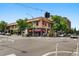 Street view of an attractive commercial building at a busy intersection with pedestrian crosswalks at 3424 W 31St Ave, Denver, CO 80211