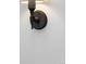 Elegant wall sconce with hand-shaped fixture illuminates the room, adding a touch of classic design at 3424 W 31St Ave, Denver, CO 80211