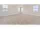 Spacious bedroom with plush carpeting and multiple windows providing ample natural light at 3979 Descent St, Castle Rock, CO 80108