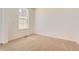 Bedroom featuring plush carpet and a large window providing ample natural light at 3979 Descent St, Castle Rock, CO 80108