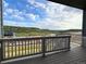 The covered deck offers panoramic views of the surrounding natural landscape at 3979 Descent St, Castle Rock, CO 80108