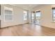 Bright living room with lots of natural light and sliding doors leading to the deck at 3979 Descent St, Castle Rock, CO 80108