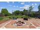 Backyard features a custom fire pit surrounded by flagstone and meticulous landscaping at 5441 Lynx St, Frederick, CO 80504