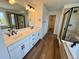 Modern bathroom with double vanity, separate shower, and soaking tub, all with stylish black fixtures at 283 Wooten Ave, Brighton, CO 80601