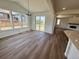 A spacious dining area with lots of natural light and access to a backyard sliding glass door at 283 Wooten Ave, Brighton, CO 80601
