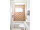 Updated bathroom featuring stylish geometric tilework and bright, neutral fixtures at 2313 S Race St # A, Denver, CO 80210