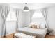 Bedroom with natural light, wood floors, and neutral tones offer a serene space at 2313 S Race St # A, Denver, CO 80210
