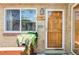 Charming brick home featuring a front door, a window box with beautiful plants, and house numbers at 2313 S Race St # A, Denver, CO 80210