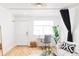 Bright living space featuring hardwood floors and a decorative light fixture at 2313 S Race St # A, Denver, CO 80210