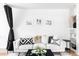 Comfortable living room with a white sofa, decorative pillows, and neutral accents that create a relaxing atmosphere at 2313 S Race St # A, Denver, CO 80210