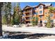 Multi-level exterior elevation featuring private balconies and rustic architectural design at 50 Mountain Thunder Dr # 1212, Breckenridge, CO 80424