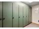 Image of a locker room with numbered, green lockers and carpet flooring, providing secure storage at 50 Mountain Thunder Dr # 1212, Breckenridge, CO 80424