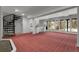 Finished basement featuring a spiral staircase, wet bar, and large windows at 150 Soda Creek Rd, Evergreen, CO 80439