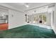 Spacious finished basement with outdoor views, adjacent kitchenette, and a walkout to the yard at 150 Soda Creek Rd, Evergreen, CO 80439