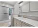 Bathroom with a shower and tub combo, a sink and lots of neutral colored tile at 150 Soda Creek Rd, Evergreen, CO 80439