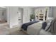Bedroom with a large bed, doors leading to a patio, and a carpet flooring at 150 Soda Creek Rd, Evergreen, CO 80439