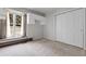 Bedroom with closet and a window with lots of natural light and plush carpet flooring at 150 Soda Creek Rd, Evergreen, CO 80439
