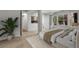 Bedroom featuring great natural light and an adjacent bathroom with neutral color scheme at 150 Soda Creek Rd, Evergreen, CO 80439