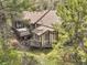 Charming home nestled among the trees with multiple decks for outdoor enjoyment at 150 Soda Creek Rd, Evergreen, CO 80439