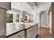 Spacious kitchen with an island, wooden floors, stainless appliances and a large bay window at 150 Soda Creek Rd, Evergreen, CO 80439
