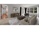 A living room featuring a large window, comfortable furniture, and an open floor plan at 150 Soda Creek Rd, Evergreen, CO 80439