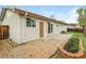 Back exterior with patio, garden bed, grass, and siding at 405 Cypress St, Broomfield, CO 80020