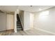 Basement area with stairs, closet, and wood-look floors at 405 Cypress St, Broomfield, CO 80020
