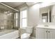 Bathroom featuring a shower over bath, toilet, vanity, and window at 405 Cypress St, Broomfield, CO 80020