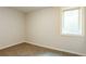 Cozy bedroom featuring neutral carpet, trim, and a window for natural light at 405 Cypress St, Broomfield, CO 80020