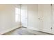 Bedroom featuring light gray flooring, window, and a neutral color palette at 405 Cypress St, Broomfield, CO 80020