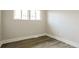 Bedroom featuring light gray flooring and a window with natural light at 405 Cypress St, Broomfield, CO 80020